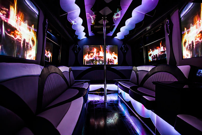 Classy, private ambiance in a party bus with several flat screen TVs